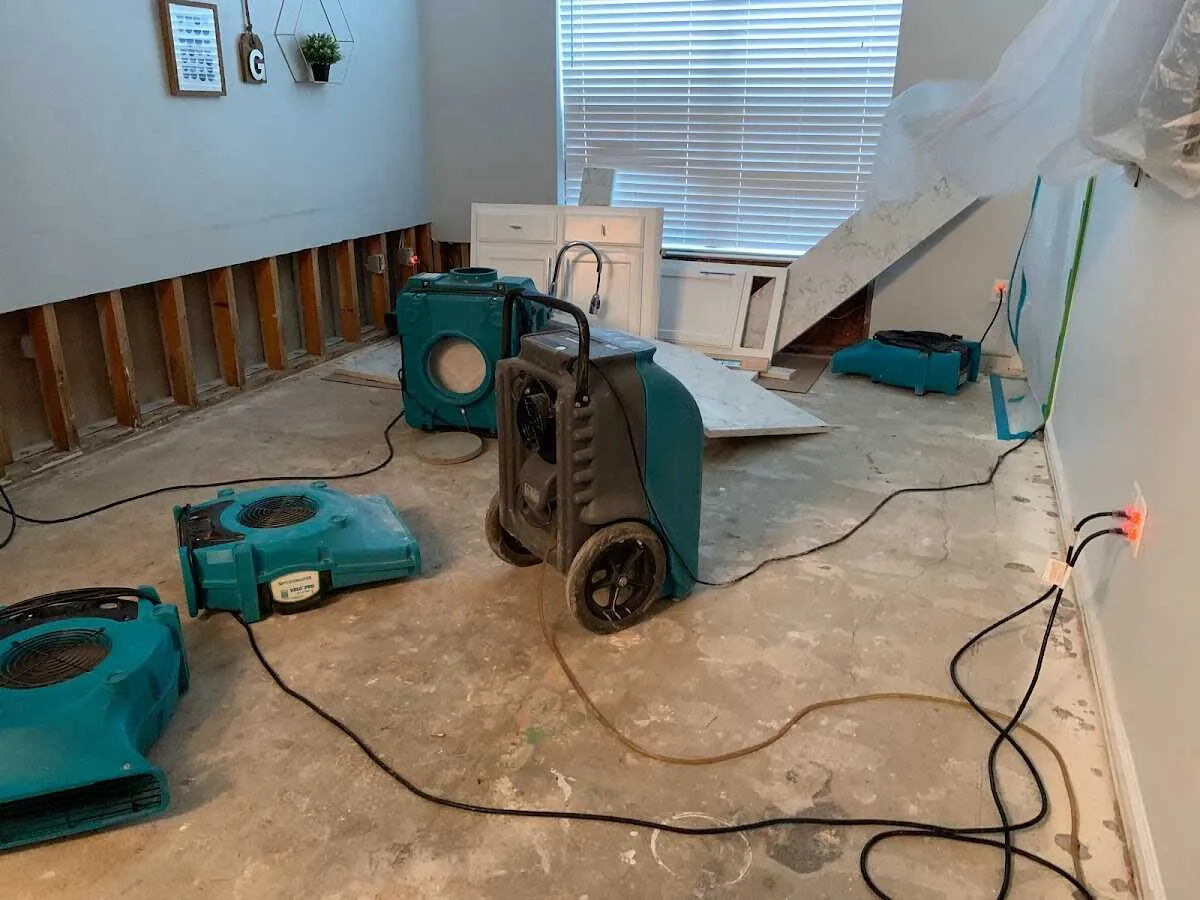 Dehumidifier in flood-cut room for Water Damage Restoration in Tallulah